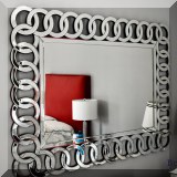 D12. Mirror with linked circles mirrored frame. 46”h x 36”w 